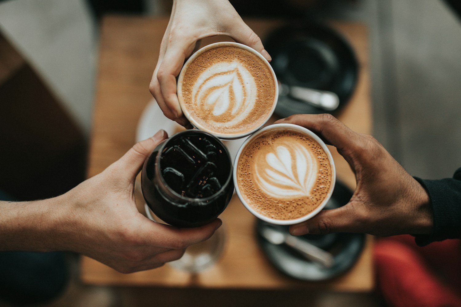 Coffee and notebook on a desk